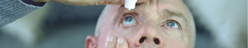 Man applying eye-drops